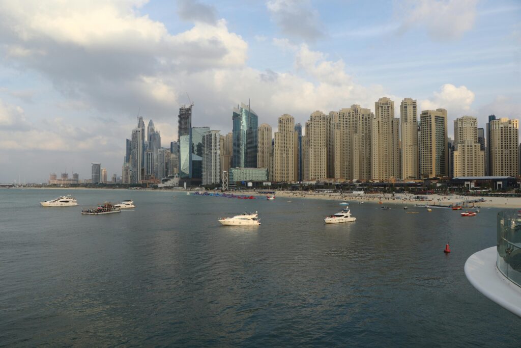 Explore the breathtaking skyline of Dubai Marina with luxury yachts in the foreground, capturing the essence of Dubai's opulence.